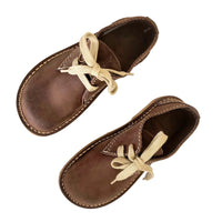 Pair of Duckfeet Jylland Cocoa leather shoes viewed from above, showing rounded toes and cream laces