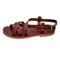 Side profile of the Duckfeet Bornholm sandal in Granate leather with adjustable ankle strap and brass-toned buckle