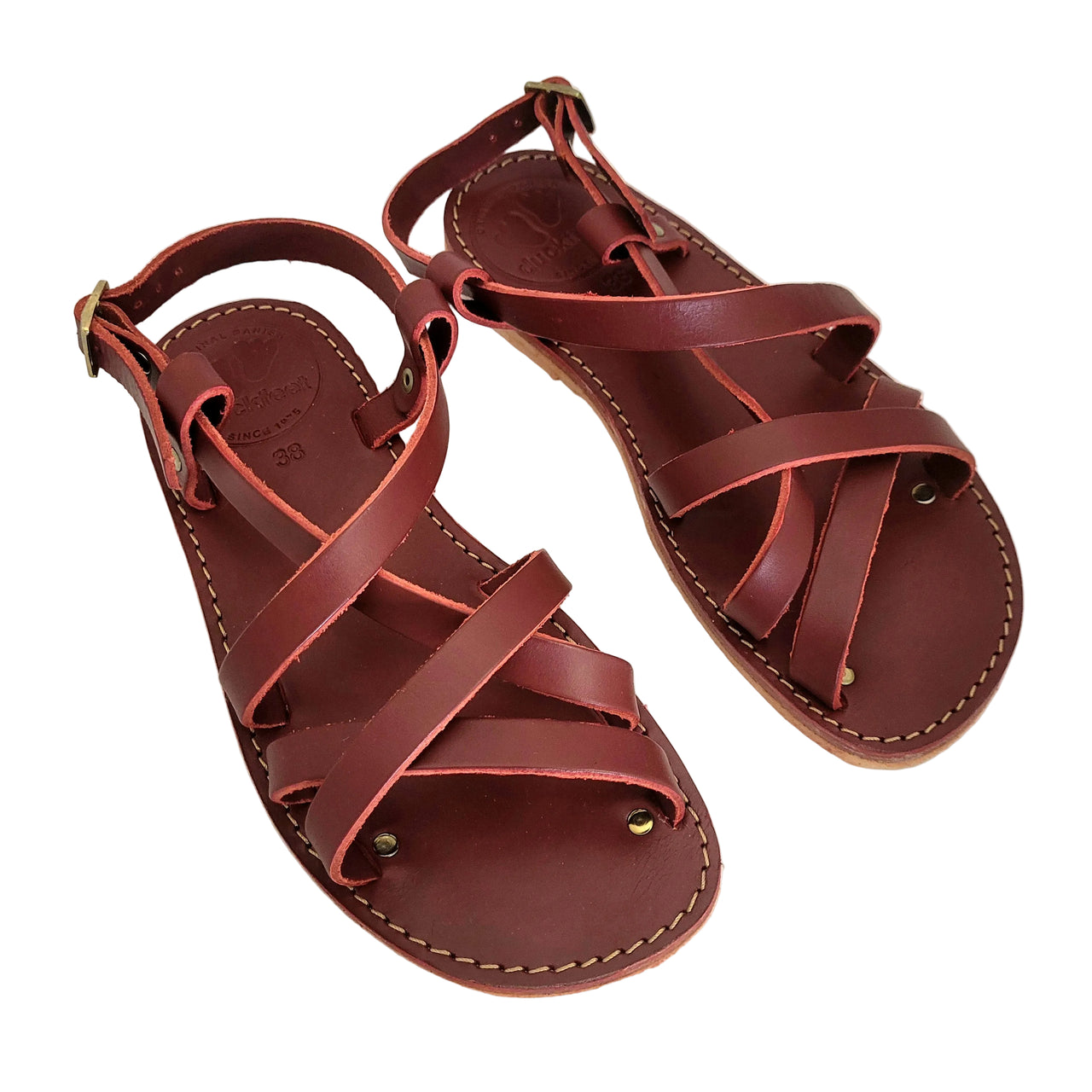 Pair of Duckfeet Bornholm sandals in Granate red leather viewed from above, showing stitched leather footbeds and