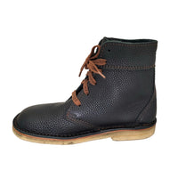 Side profile of Duckfeet Sonderborg black leather ankle boot on a pale stitched sole