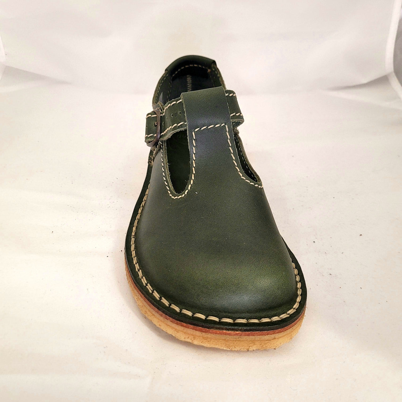 Front view of a green leather Duckfeet Lolland Mary Jane, showing the rounded toe and buckled T-bar