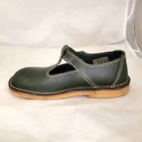 Side profile of a green leather Duckfeet Lolland Mary Jane flat with pale natural-coloured sole