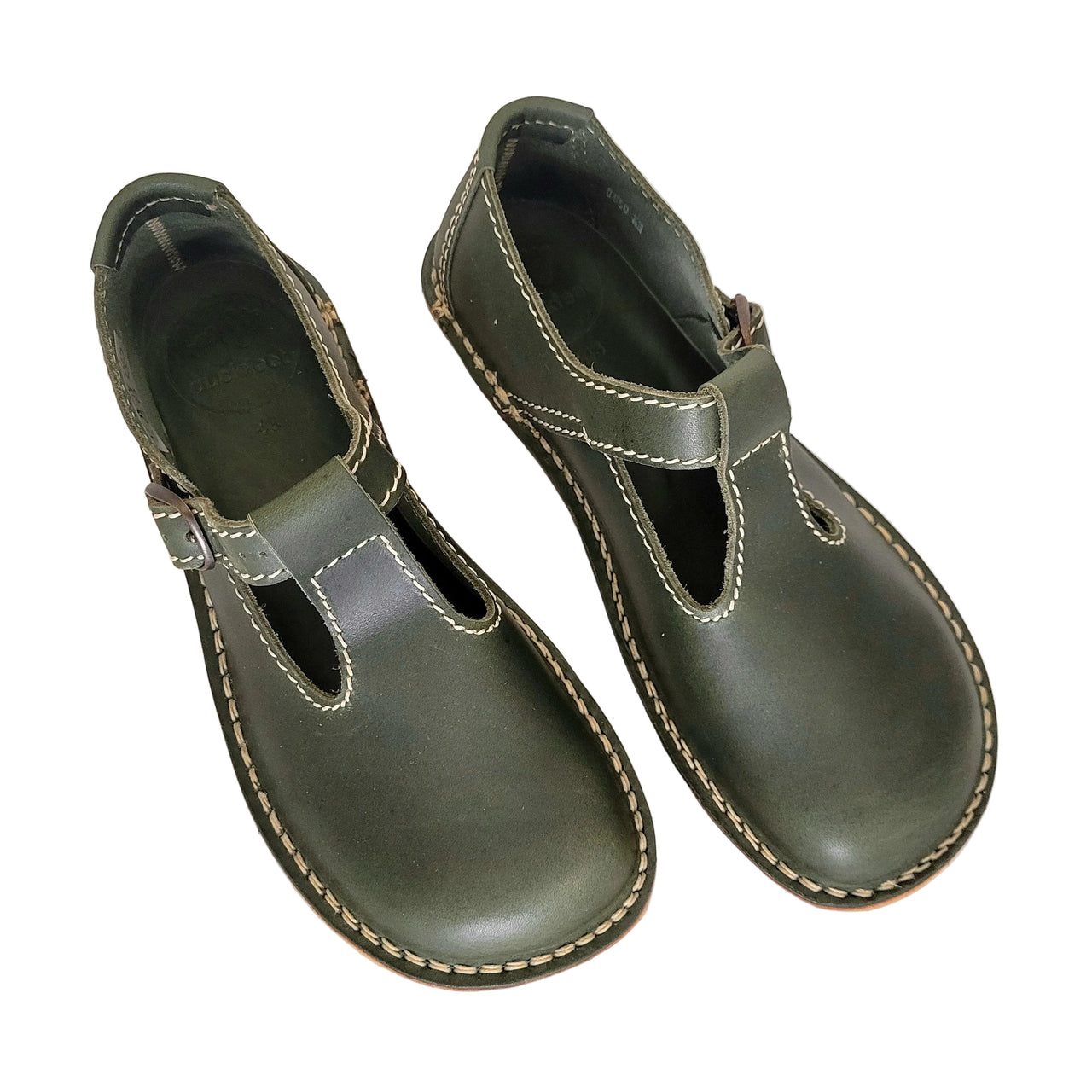 Pair of green leather Duckfeet Lolland Mary Janes viewed from above, showing T-bar straps and rounded toes