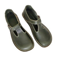 Pair of green leather Duckfeet Lolland Mary Janes viewed from above, showing T-bar straps and rounded toes