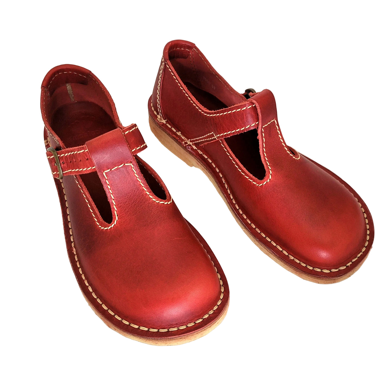 Pair of red leather Duckfeet Lolland Mary Janes viewed from above at an angle, showing T-bar straps and buckles