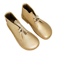 Pair of gold leather Duckfeet Helsingor lace-up boots photographed from above