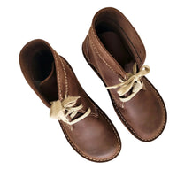 Pair of Duckfeet Faborg cocoa leather boots viewed from above, laces tied