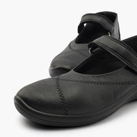 Black leather shoe with a strap