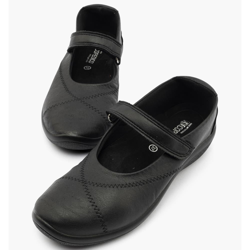 Pair of black shoes with velcro straps 