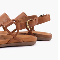 Brown sandals with a gold buckle