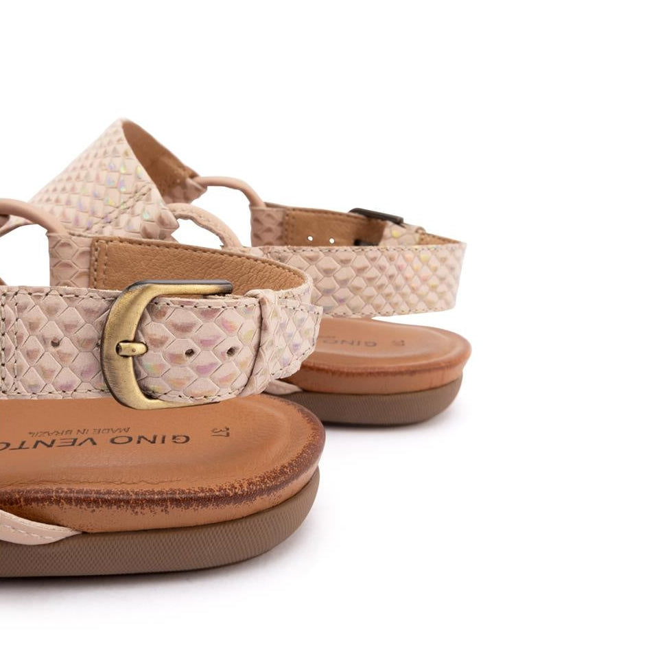 Pair of sandals with a patterned strap and gold buckle